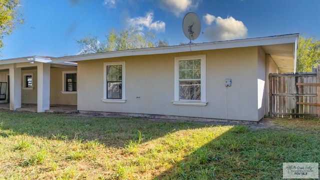 view of side of property with a yard