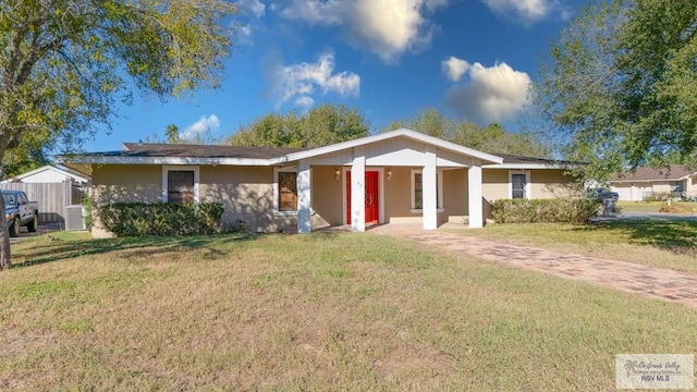 ranch-style home featuring central AC and a front lawn