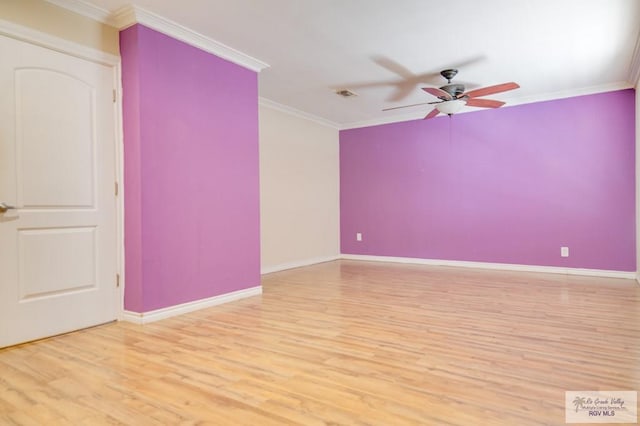 spare room featuring crown molding, ceiling fan, and light hardwood / wood-style floors