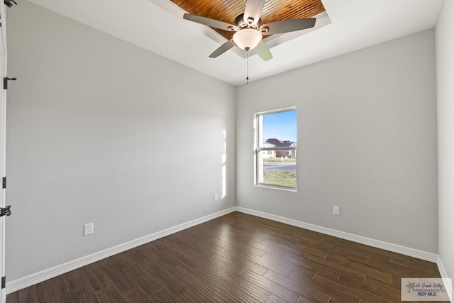 unfurnished room featuring ceiling fan and dark wood-type flooring