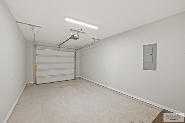 garage with a garage door opener and electric panel