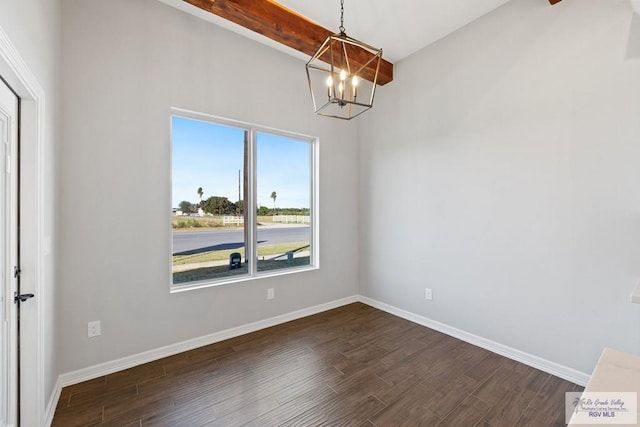 unfurnished dining area featuring dark hardwood / wood-style flooring and a chandelier