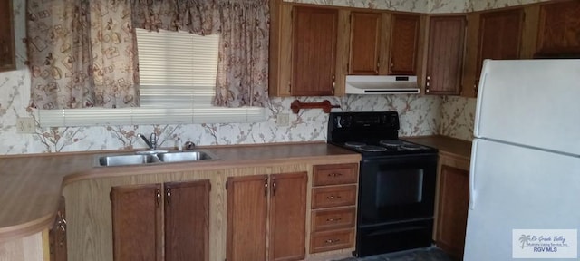 kitchen featuring backsplash, white fridge, sink, and black electric range