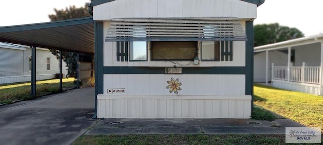 view of side of home featuring a carport