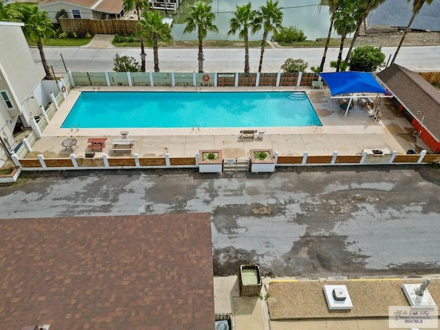 view of swimming pool with a patio