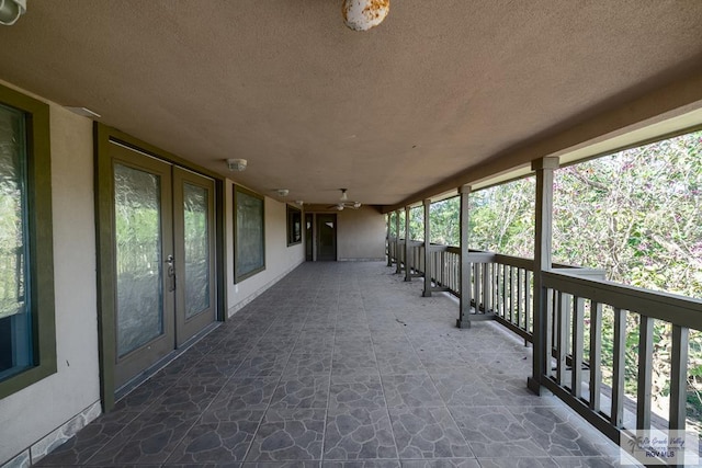 view of patio / terrace with ceiling fan and french doors