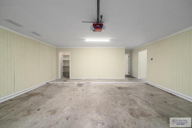 garage featuring visible vents and a garage door opener