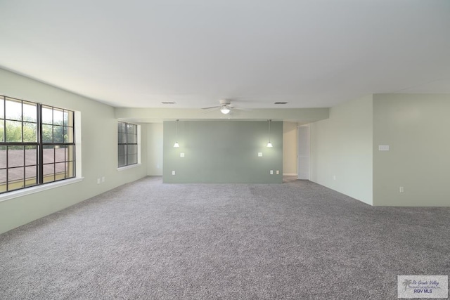 carpeted empty room with ceiling fan