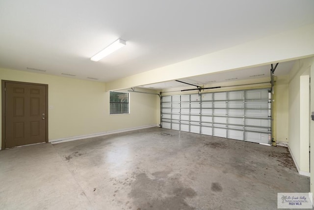 garage featuring baseboards