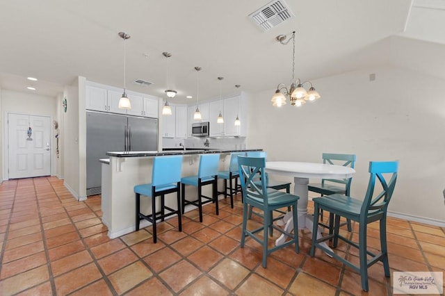 301 Houston Ave Unit 3402, Port Isabel, TX 78578 - dining space with recessed lighting, a chandelier, and vaulted ceiling