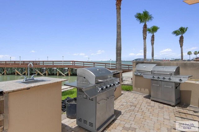 301 Houston Ave Unit 3402, Port Isabel, TX 78578 - view of patio / terrace featuring area for grilling and a water view