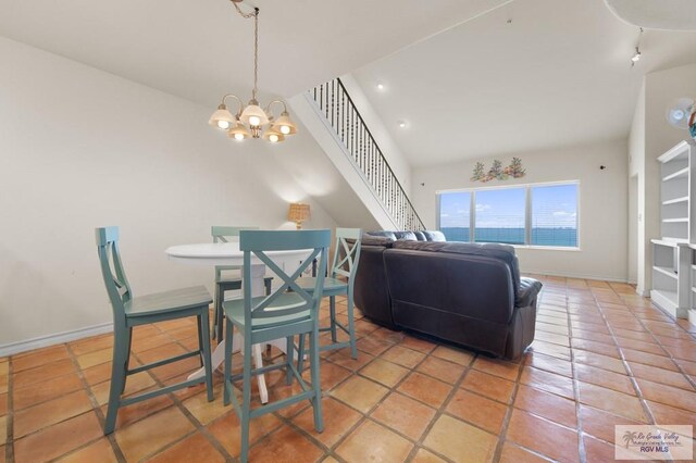 301 Houston Ave Unit 3402, Port Isabel, TX 78578 - dining room with a chandelier, stairway, and light tile patterned flooring