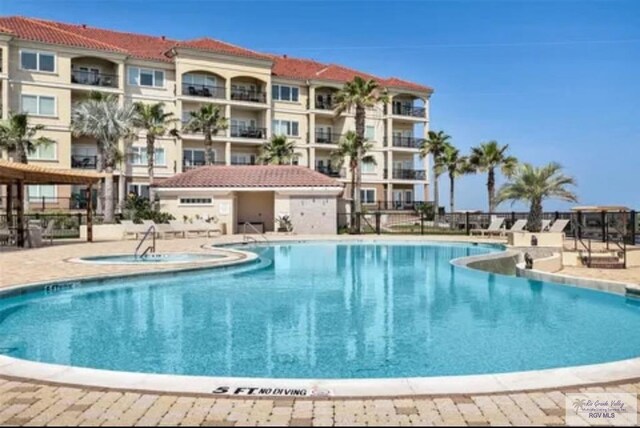 301 Houston Ave Unit 3402, Port Isabel, TX 78578 - community pool featuring a patio area