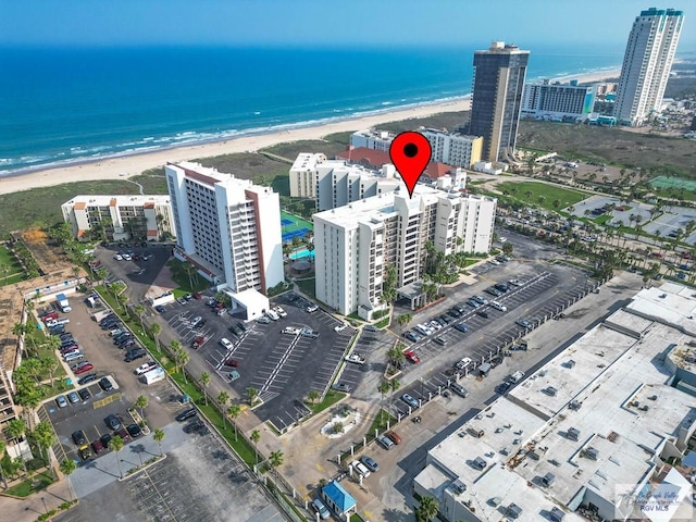 birds eye view of property featuring a view of the beach and a water view