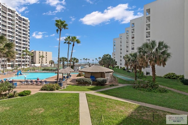 view of swimming pool featuring a lawn