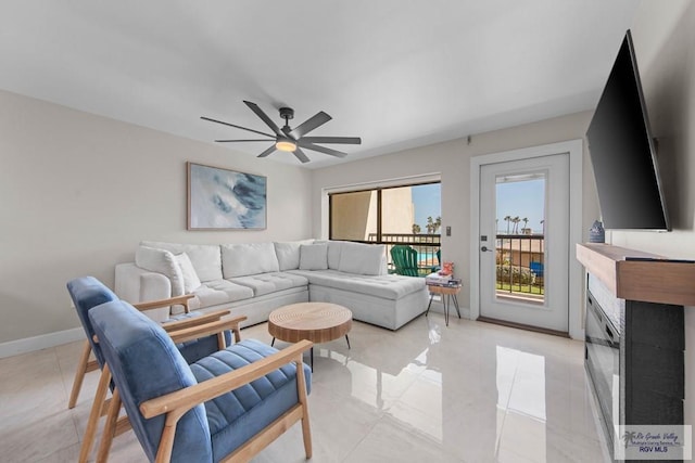 tiled living room featuring ceiling fan