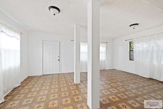 entryway with a textured ceiling