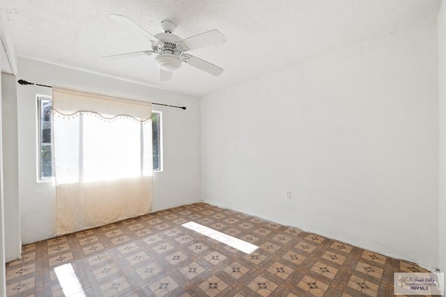 empty room featuring ceiling fan