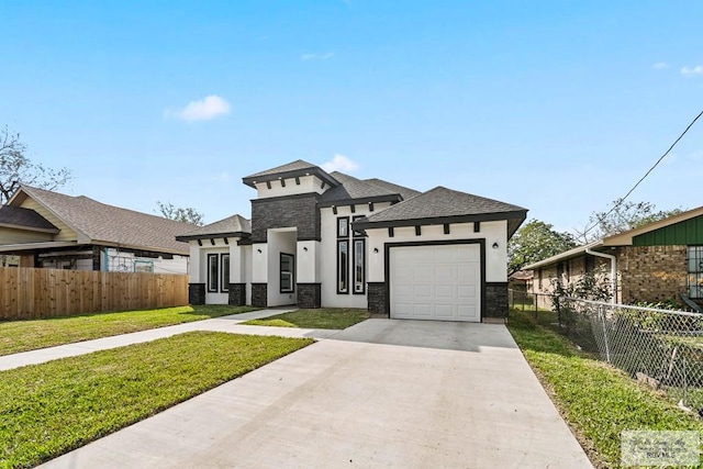 view of front facade with a garage and a front lawn