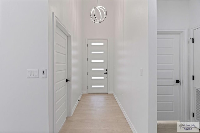 doorway with light hardwood / wood-style flooring