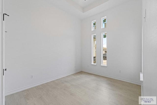 unfurnished room featuring light hardwood / wood-style floors