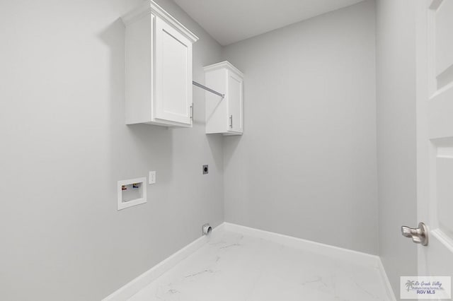 clothes washing area featuring cabinets, hookup for a washing machine, and electric dryer hookup