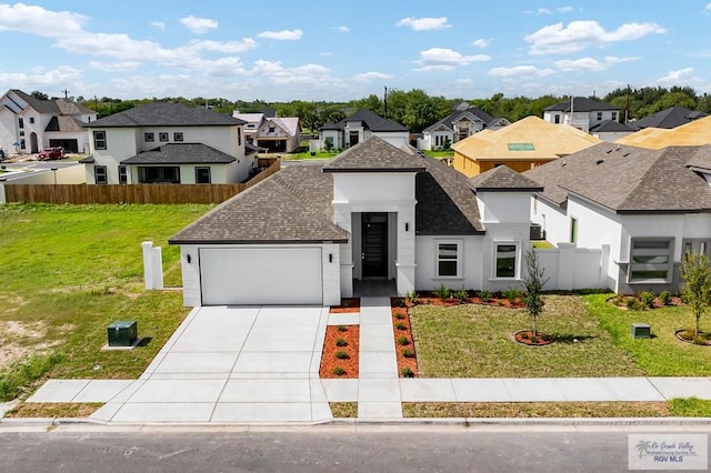 view of front facade with a garage and a front yard