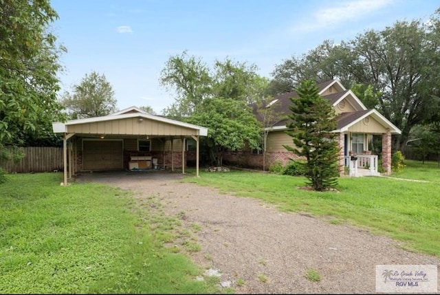 501 Ratliff St, San Benito, TX 78586 - view of property exterior featuring a garage and dirt driveway