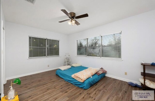 501 Ratliff St, San Benito, TX 78586 - bedroom featuring wood finished floors and a ceiling fan