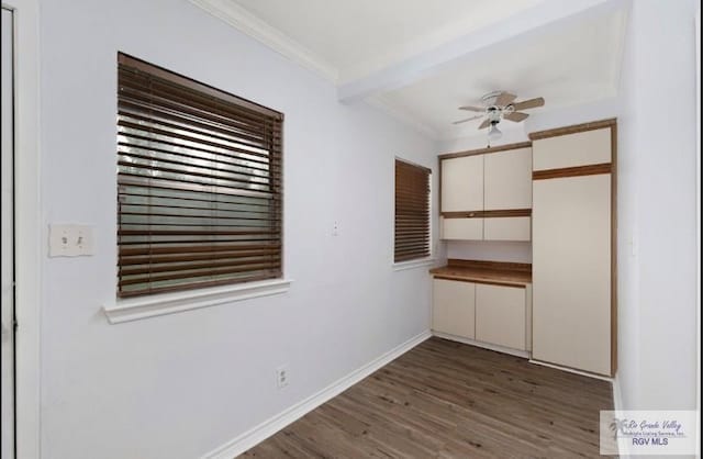 501 Ratliff St, San Benito, TX 78586 - unfurnished dining area featuring crown molding, wood finished floors, and a ceiling fan