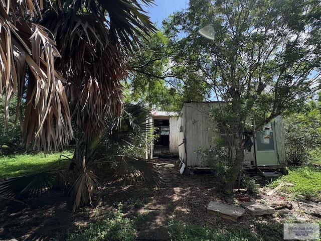 501 Ratliff St, San Benito, TX 78586 - view of yard featuring a storage unit