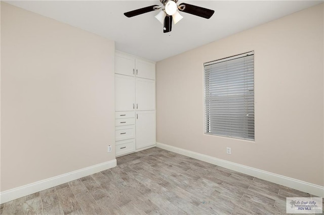 unfurnished bedroom featuring ceiling fan and light wood-type flooring