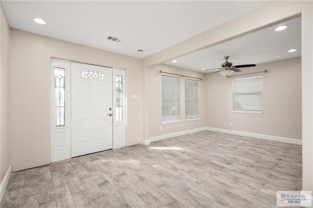 foyer entrance featuring ceiling fan and light wood-type flooring