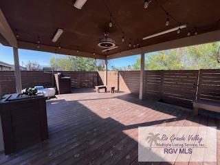 deck featuring a gazebo and ceiling fan