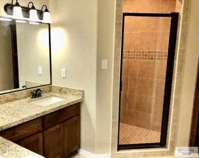 401 S Tamm Ln, Harlingen, TX 78550 - bathroom with a stall shower and vanity
