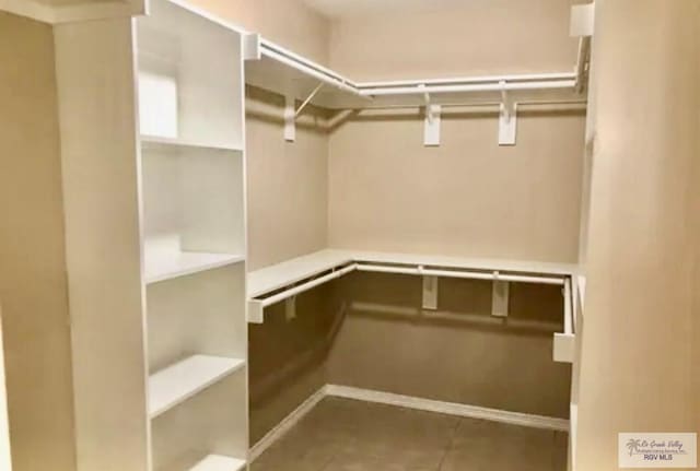 401 S Tamm Ln, Harlingen, TX 78550 - walk in closet featuring tile patterned floors