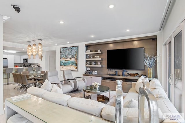 living room featuring an inviting chandelier