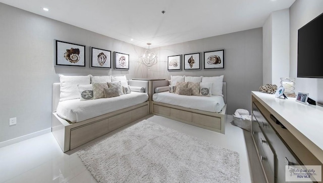 bedroom featuring a notable chandelier