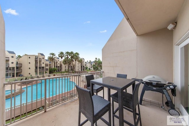 balcony featuring area for grilling and a patio