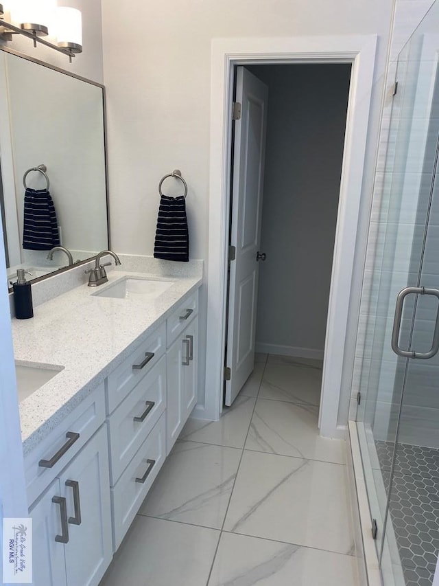 bathroom with walk in shower and vanity