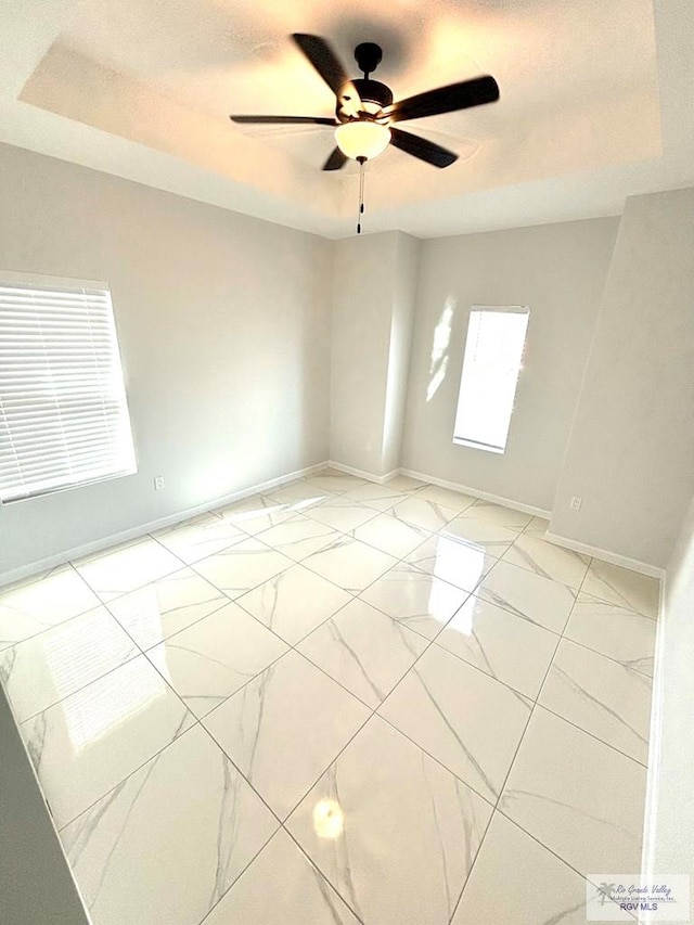 unfurnished room with a textured ceiling and ceiling fan