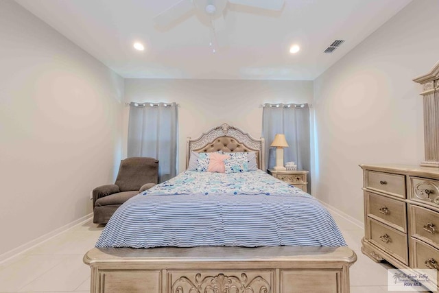 bedroom featuring a ceiling fan, baseboards, and light tile patterned floors