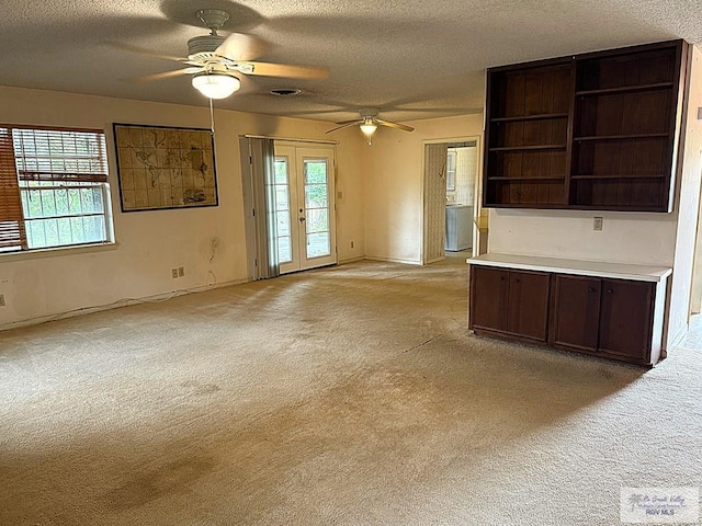 38 Palmetto Cir, Brownsville, TX 78521 - unfurnished living room with a ceiling fan, light carpet, a textured ceiling, and baseboards