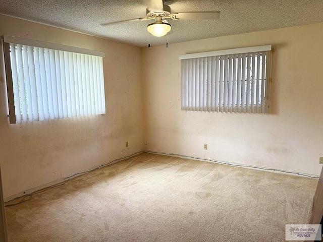 38 Palmetto Cir, Brownsville, TX 78521 - unfurnished room with carpet flooring, a ceiling fan, and a textured ceiling