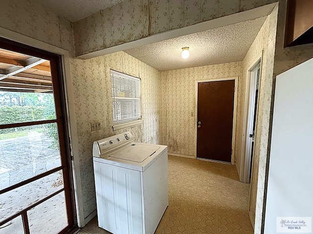 38 Palmetto Cir, Brownsville, TX 78521 - laundry area with washer / dryer, wallpapered walls, and a textured ceiling