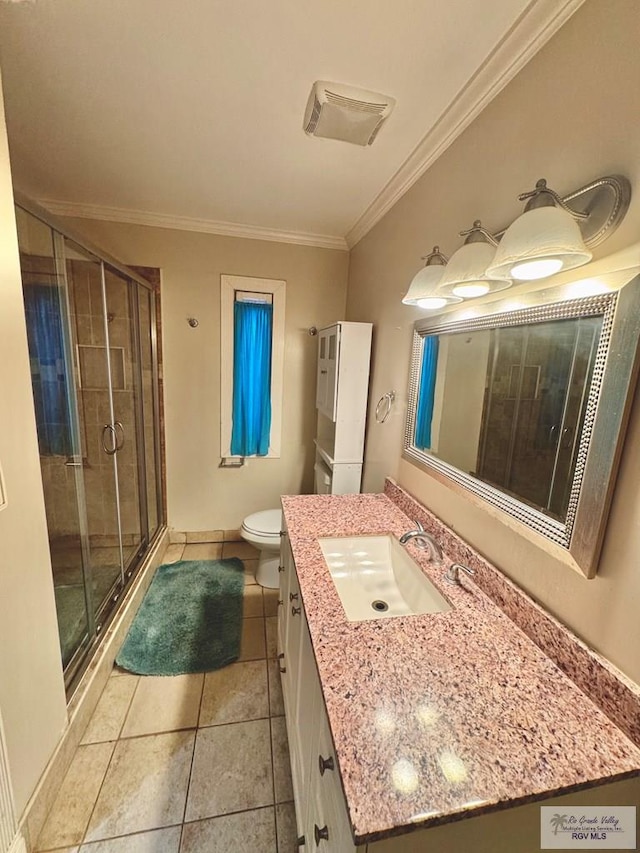 bathroom with vanity, a shower with door, tile patterned floors, toilet, and ornamental molding