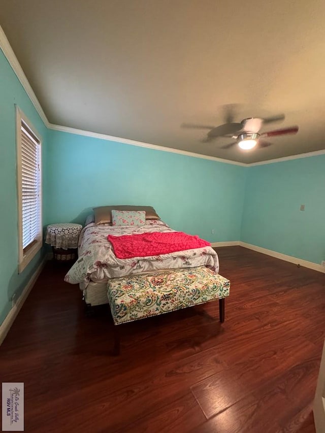 bedroom with ceiling fan, dark hardwood / wood-style flooring, and ornamental molding