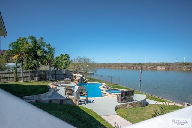 view of swimming pool featuring a water view, a fenced backyard, a pool with connected hot tub, and a patio