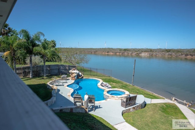 view of pool featuring a patio, a fenced backyard, a water view, a pool with connected hot tub, and a lawn