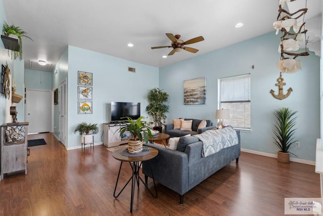 living area with attic access, a ceiling fan, recessed lighting, wood finished floors, and visible vents